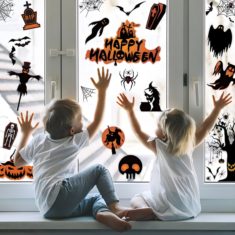 Children sitting on a windowsill with Halloween-themed window decals.
